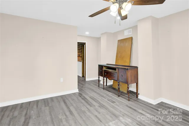 wooden floor in a hall with a workspace