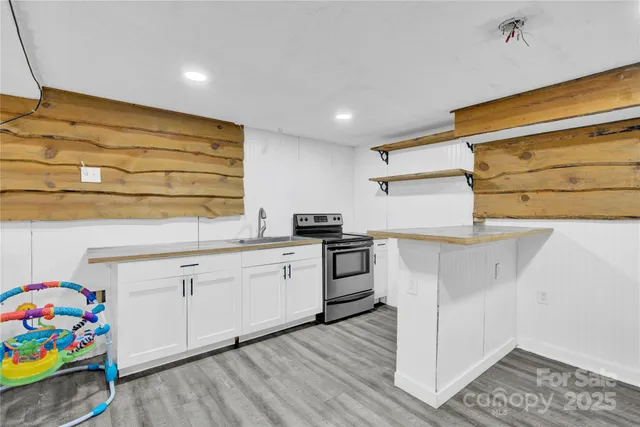 a kitchen with granite countertop a sink and cabinets