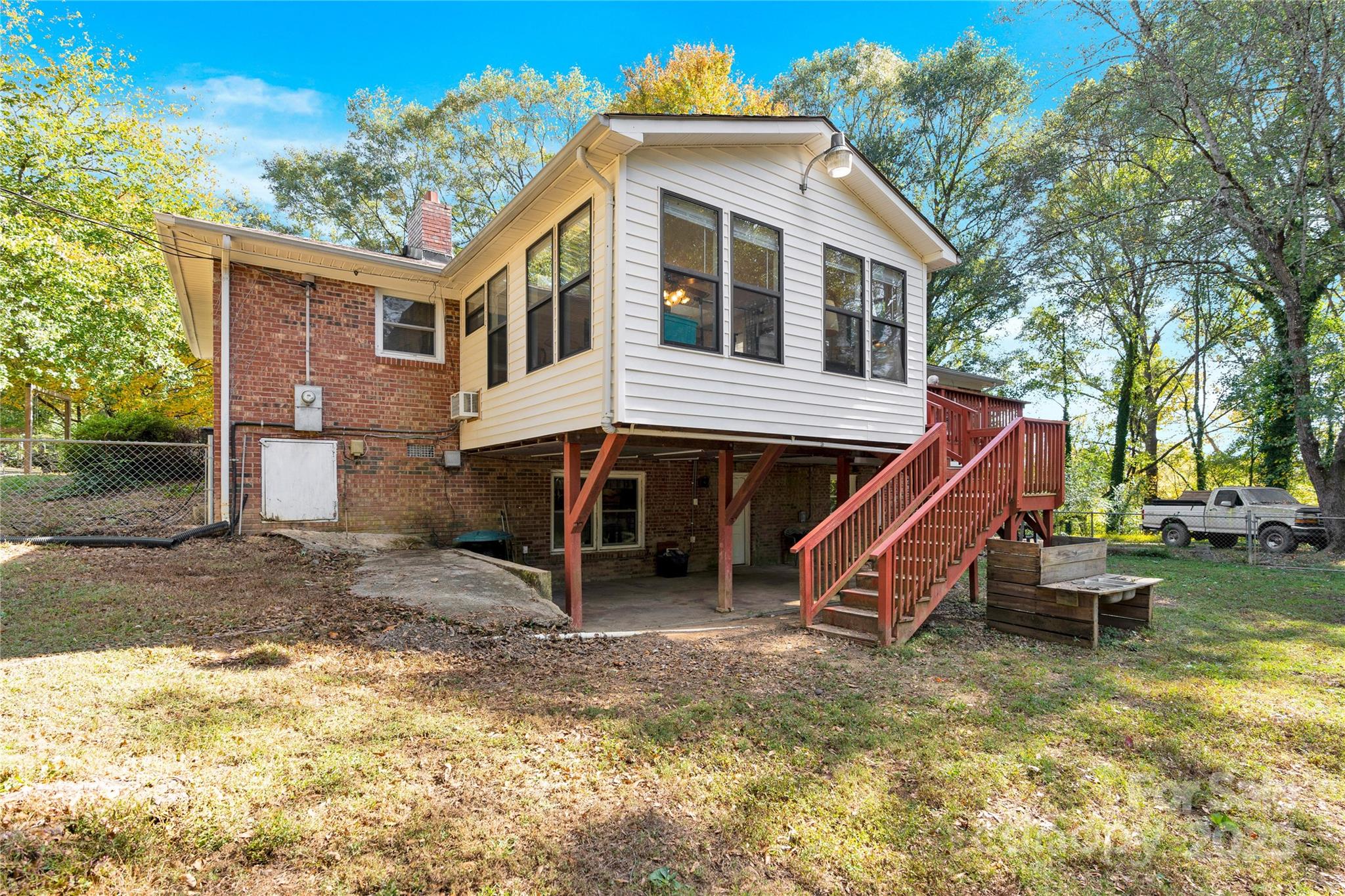 841 Knowles Drive Dallas, NC 28034 - Photo 41 of 46 a view of a house with a yard and sitting area