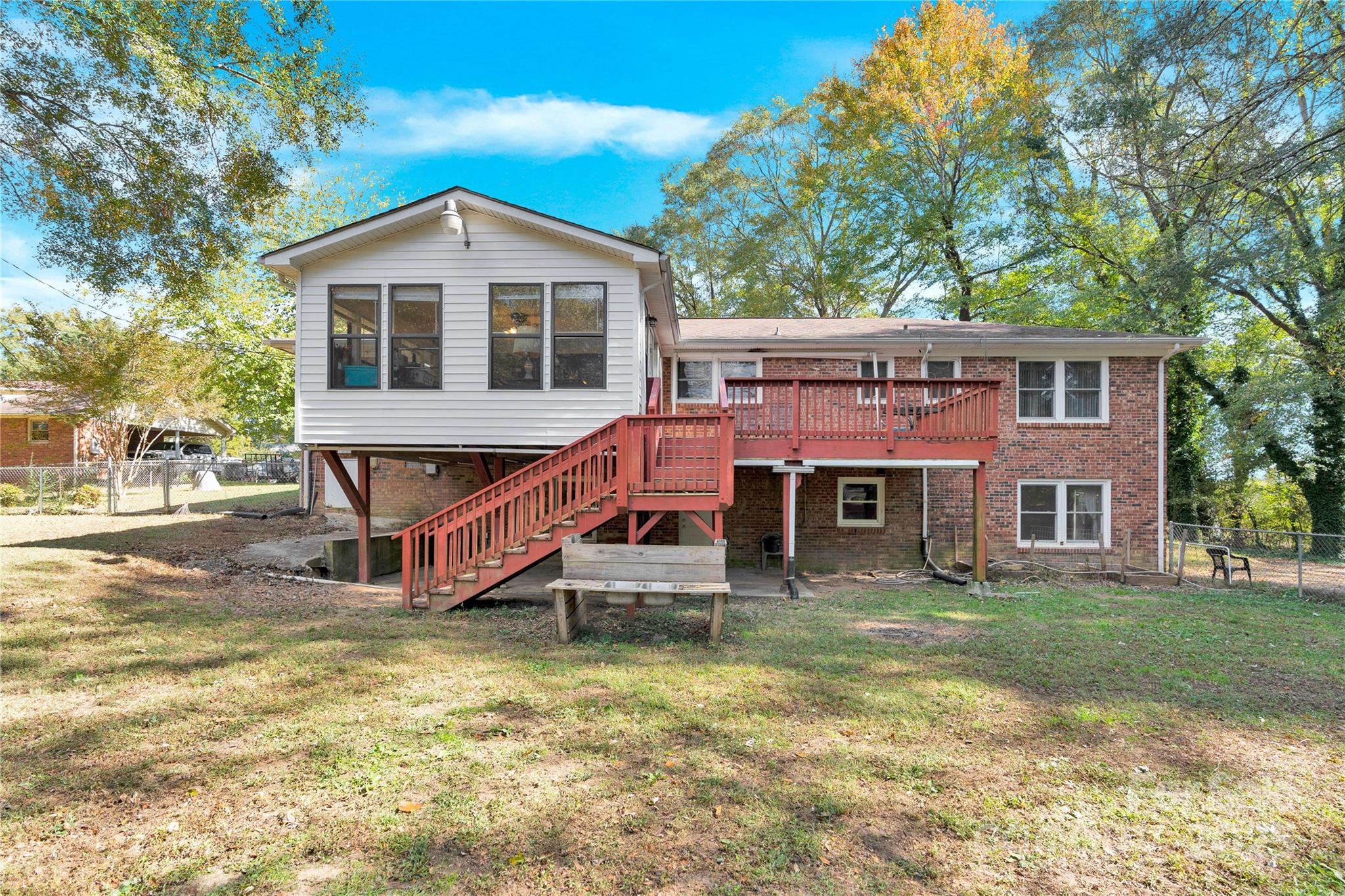 841 Knowles Drive Dallas, NC 28034 - Photo 42 of 46 a front view of a house with a yard table and chairs