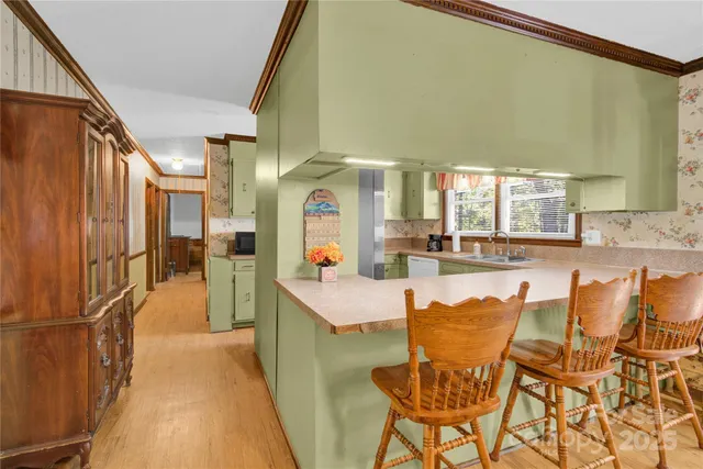 a very nice looking dining room with a large window
