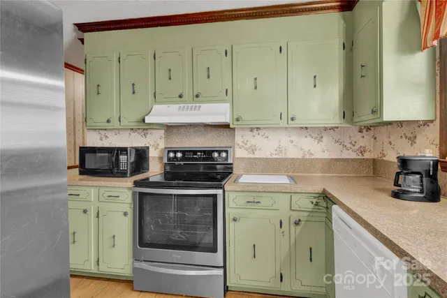a kitchen with a stove and cabinets