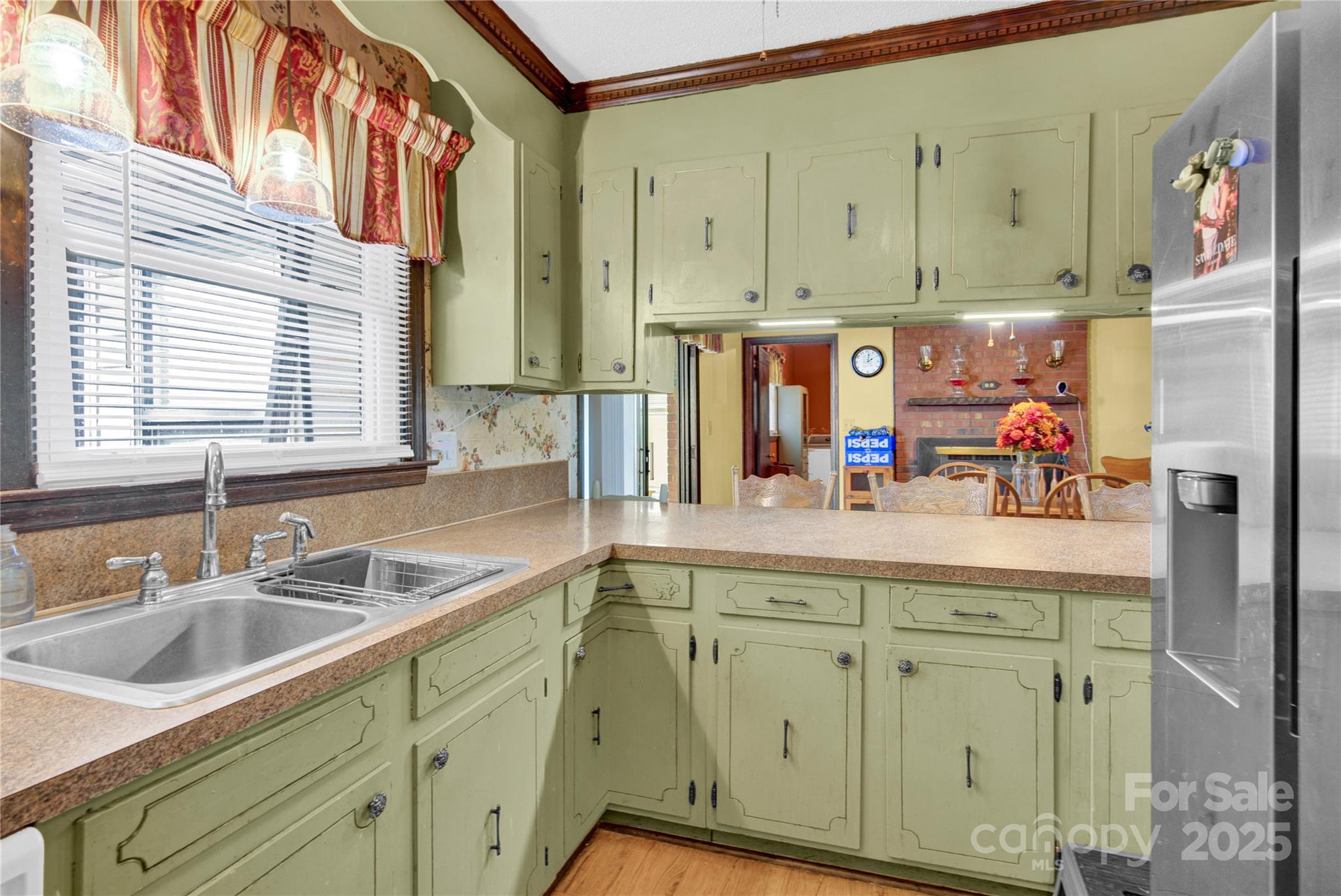 841 Knowles Drive Dallas, NC 28034 - Photo 9 of 46 a kitchen with stainless steel appliances white cabinets and a sink