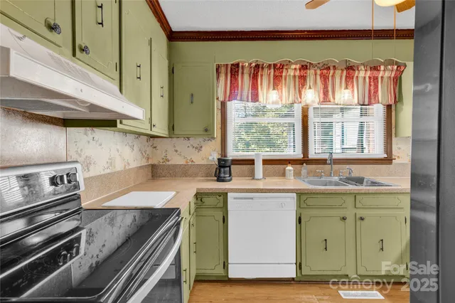 a kitchen with a sink and a stove top oven