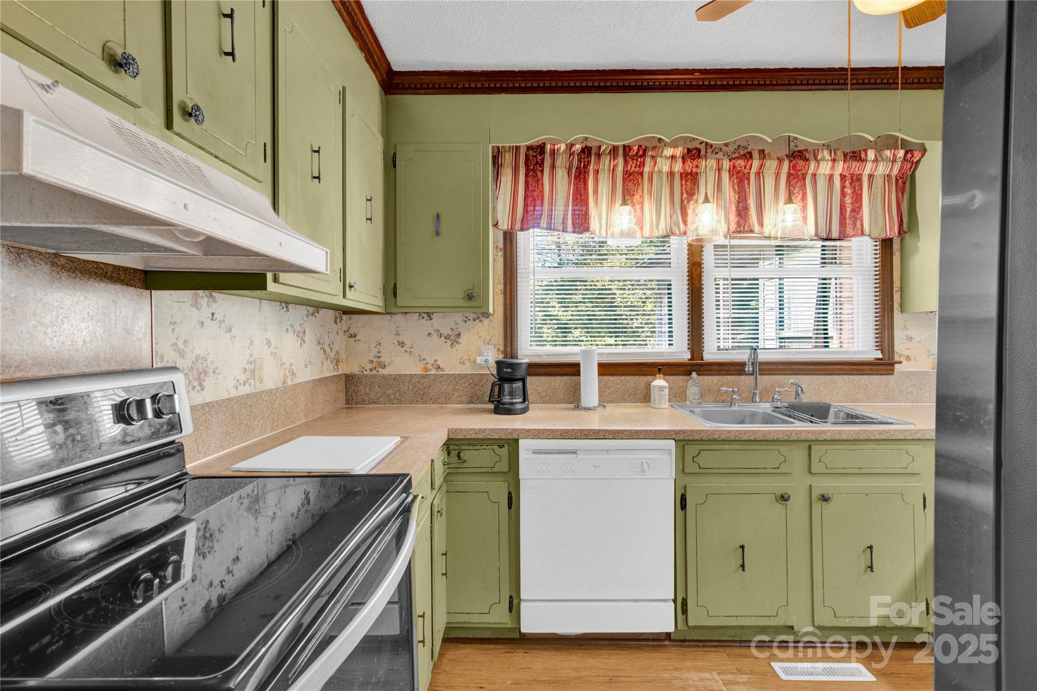 841 Knowles Drive Dallas, NC 28034 - Photo 10 of 46 a kitchen with a sink and a stove top oven