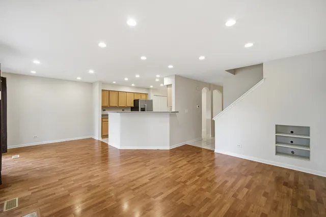 a view of kitchen and wooden floor