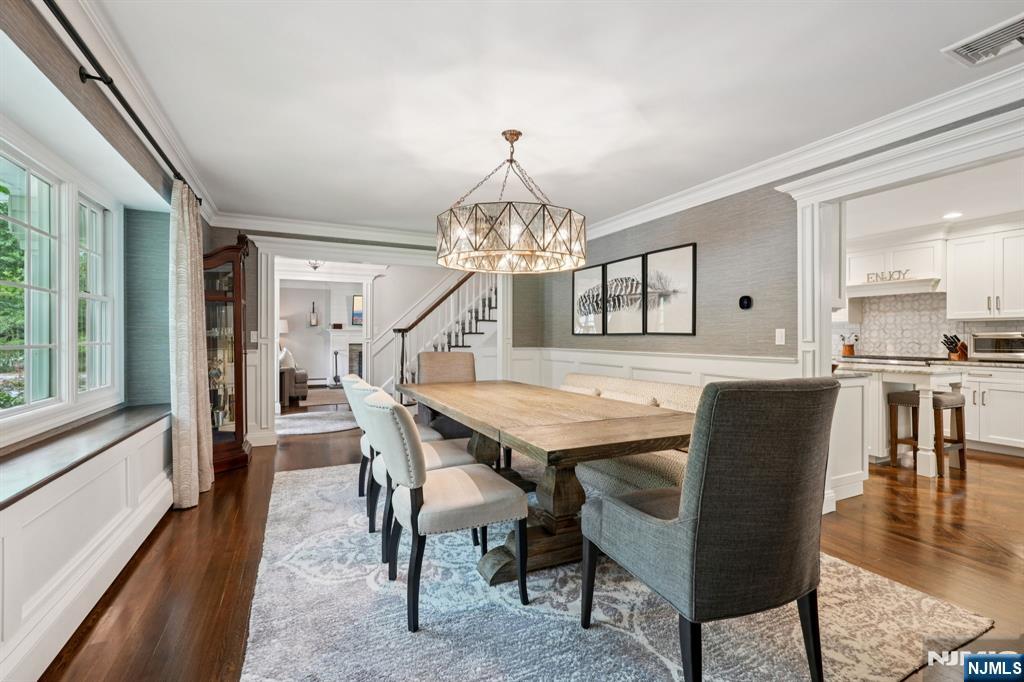1015 High Mountain Road Franklin Lakes, NJ 07417 - Photo 15 of 48 a dining room with furniture a chandelier and wooden floor