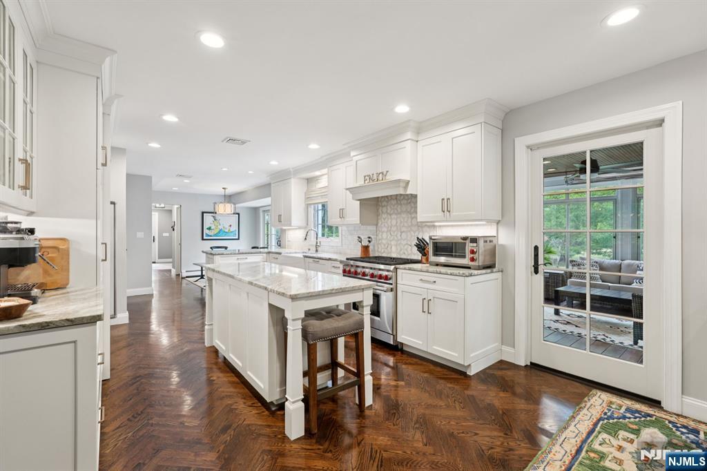 1015 High Mountain Road Franklin Lakes, NJ 07417 - Photo 18 of 48 a kitchen with a stove a sink and a refrigerator