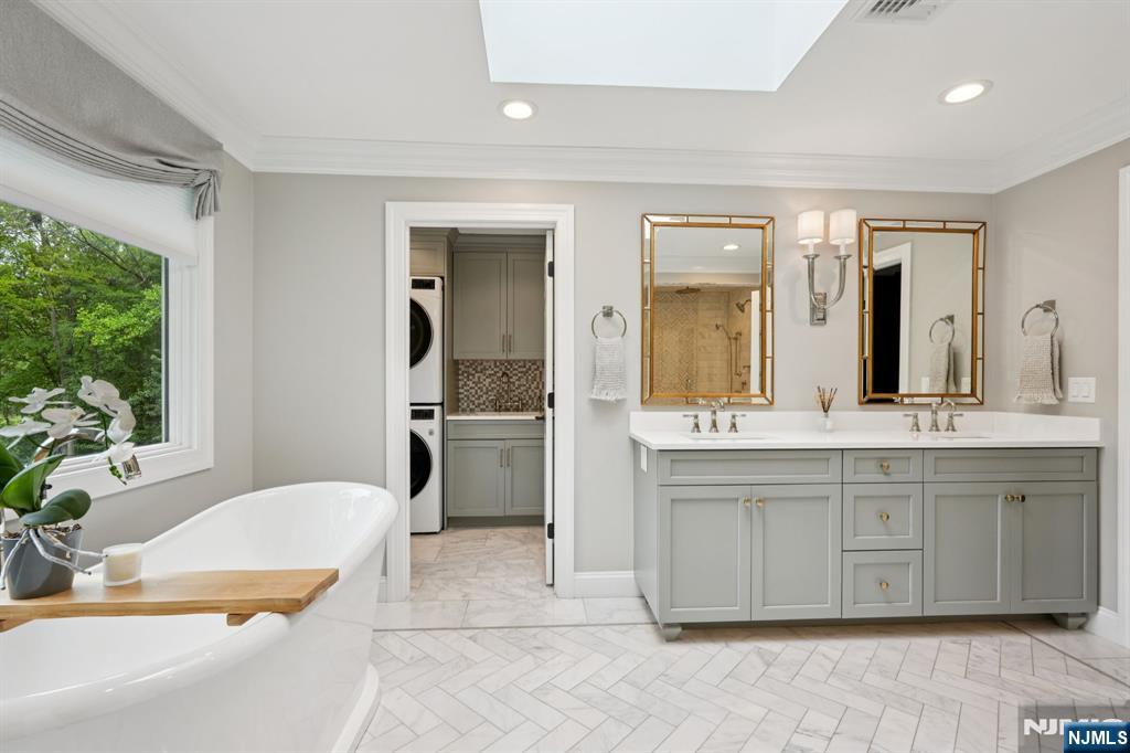 1015 High Mountain Road Franklin Lakes, NJ 07417 - Photo 35 of 48 a spacious bathroom with a tub sink and mirror