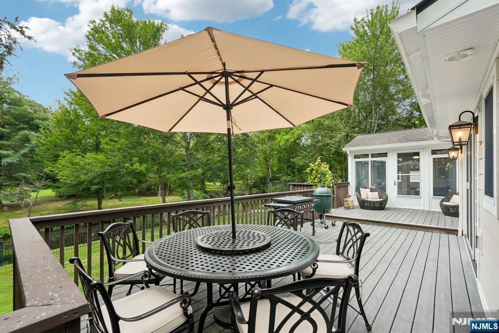 1015 High Mountain Road Franklin Lakes, NJ 07417 - Photo 41 of 48 a view of balcony with furniture and umbrella