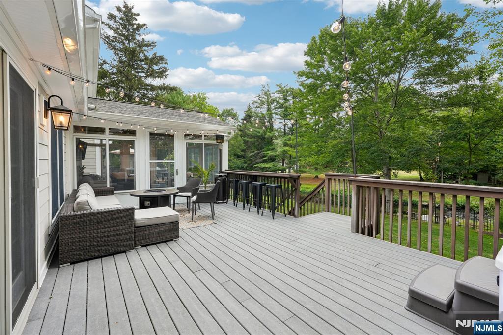1015 High Mountain Road Franklin Lakes, NJ 07417 - Photo 43 of 48 a balcony with wooden floor table and chairs