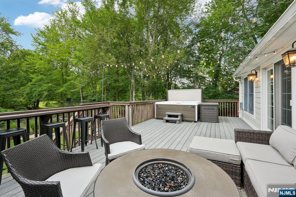 1015 High Mountain Road Franklin Lakes, NJ 07417 - Photo 44 of 48 a view of a patio with a table and chairs