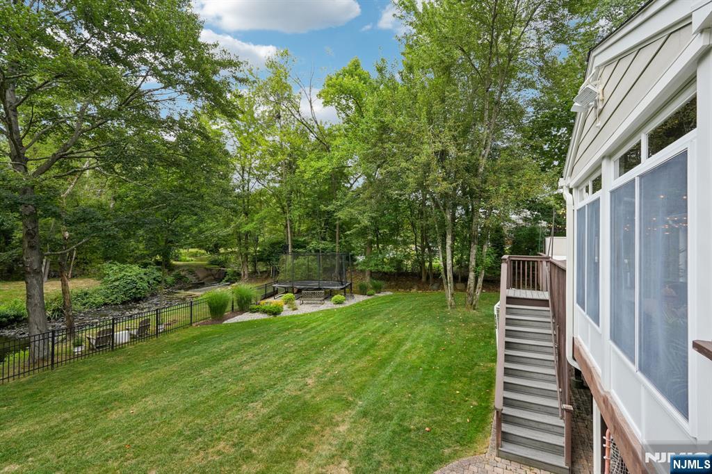 1015 High Mountain Road Franklin Lakes, NJ 07417 - Photo 47 of 48 a view of a backyard with sitting area
