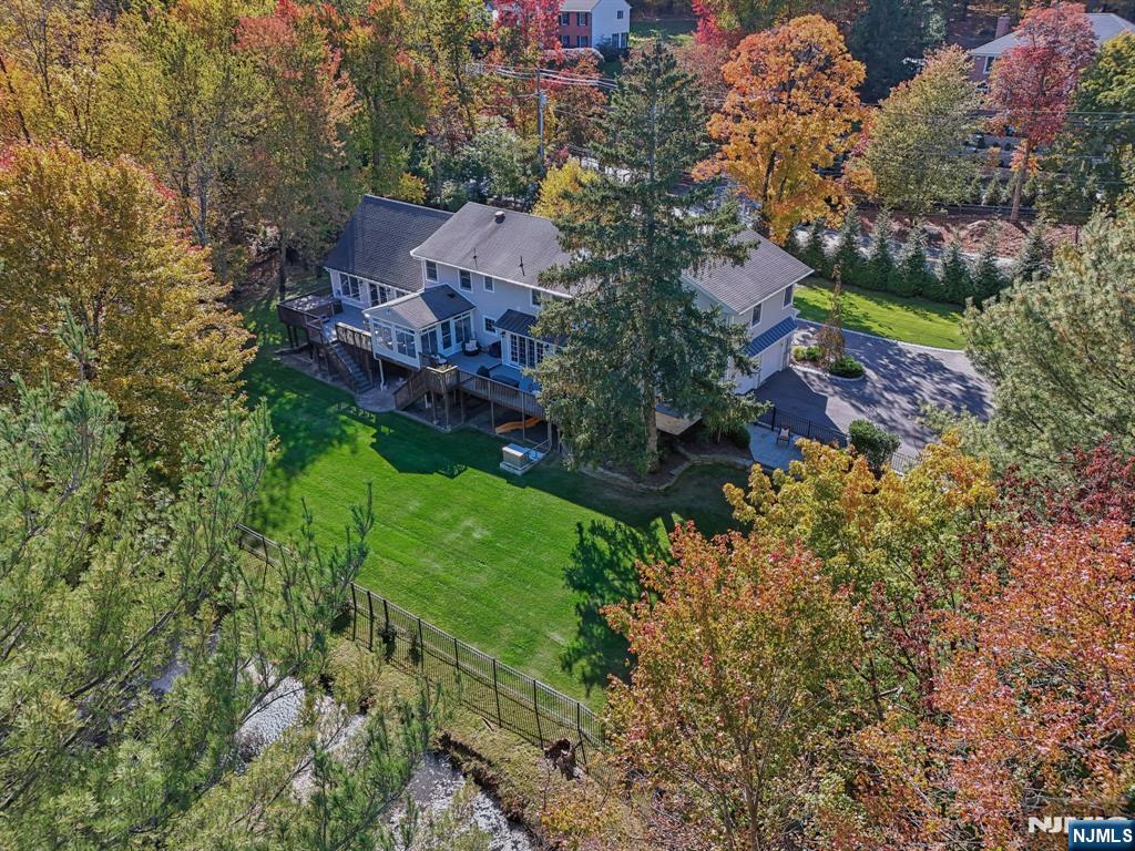 1015 High Mountain Road Franklin Lakes, NJ 07417 - Photo 6 of 48 a view of a house with a yard