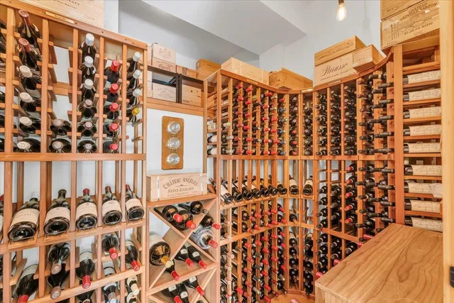 a view of a black door and wooden floor