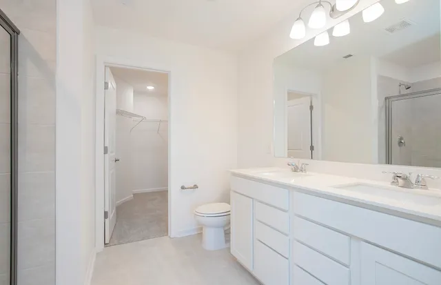 a bathroom with a glass shower door