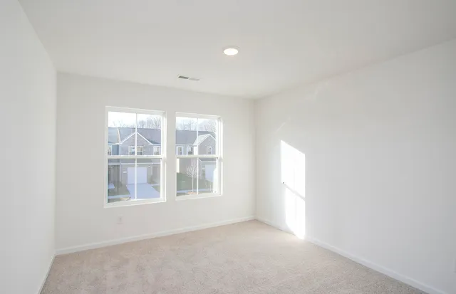 a bathroom with a granite countertop sink a toilet and bathtub