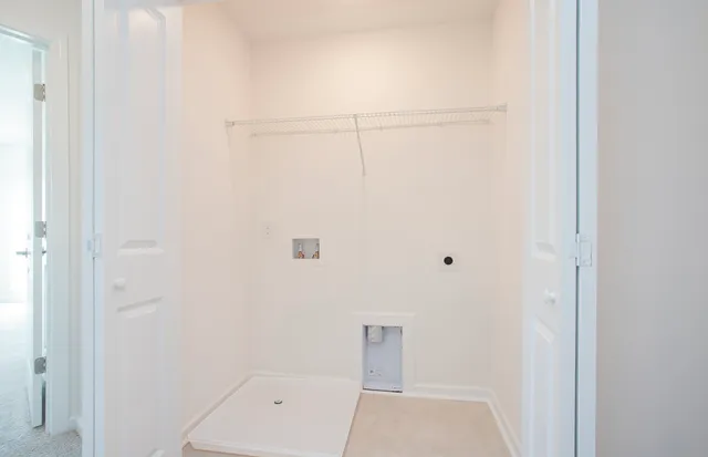 a view of a closet area with ceiling fan