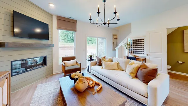 a living room with fireplace furniture and a flat screen tv