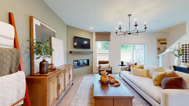 a living room with furniture fireplace and flat screen tv