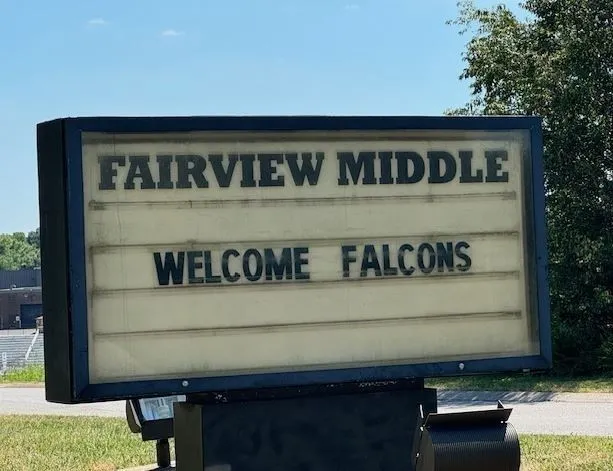 a sign on the wall of a building