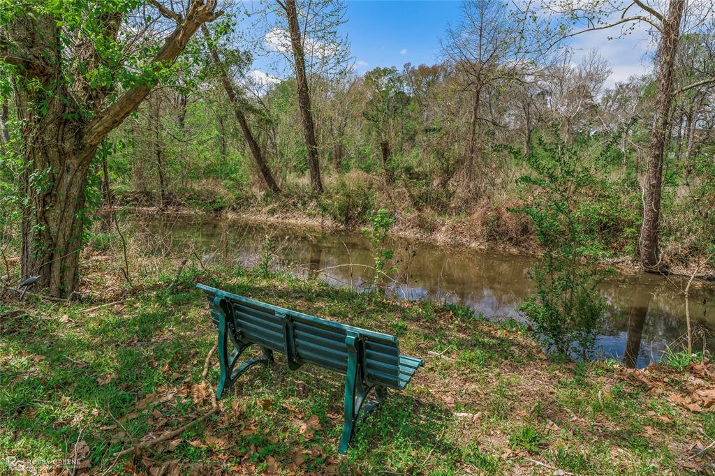 224 Prysock Road Doyline, LA 71023 - Photo 27 of 34 a garden view with a bench