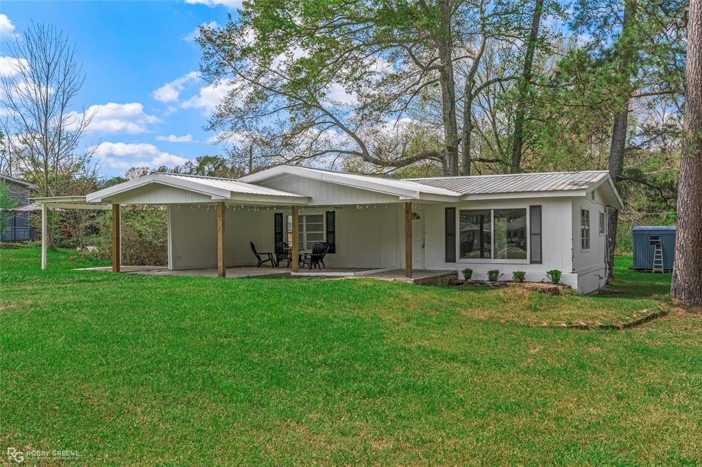 224 Prysock Road Doyline, LA 71023 - Photo 32 of 34 a view of a house with a backyard