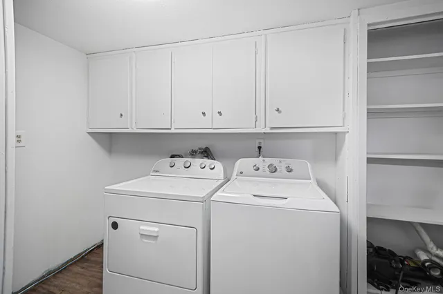 a view of storage and utility room with washer and dryer