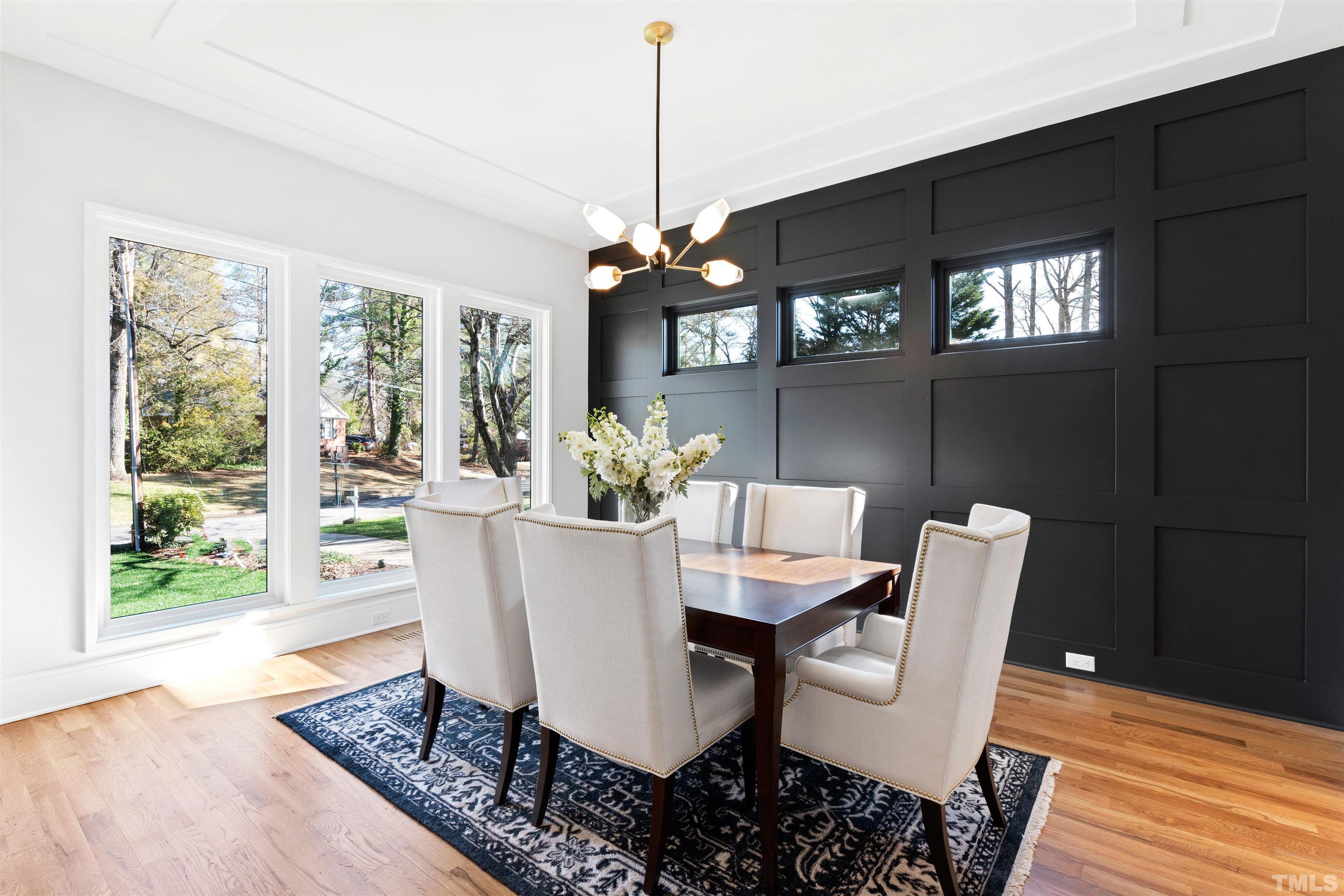 604 Yale Street Raleigh, NC 27609 - Photo 10 of 74 a dining room with furniture a chandelier and wooden floor