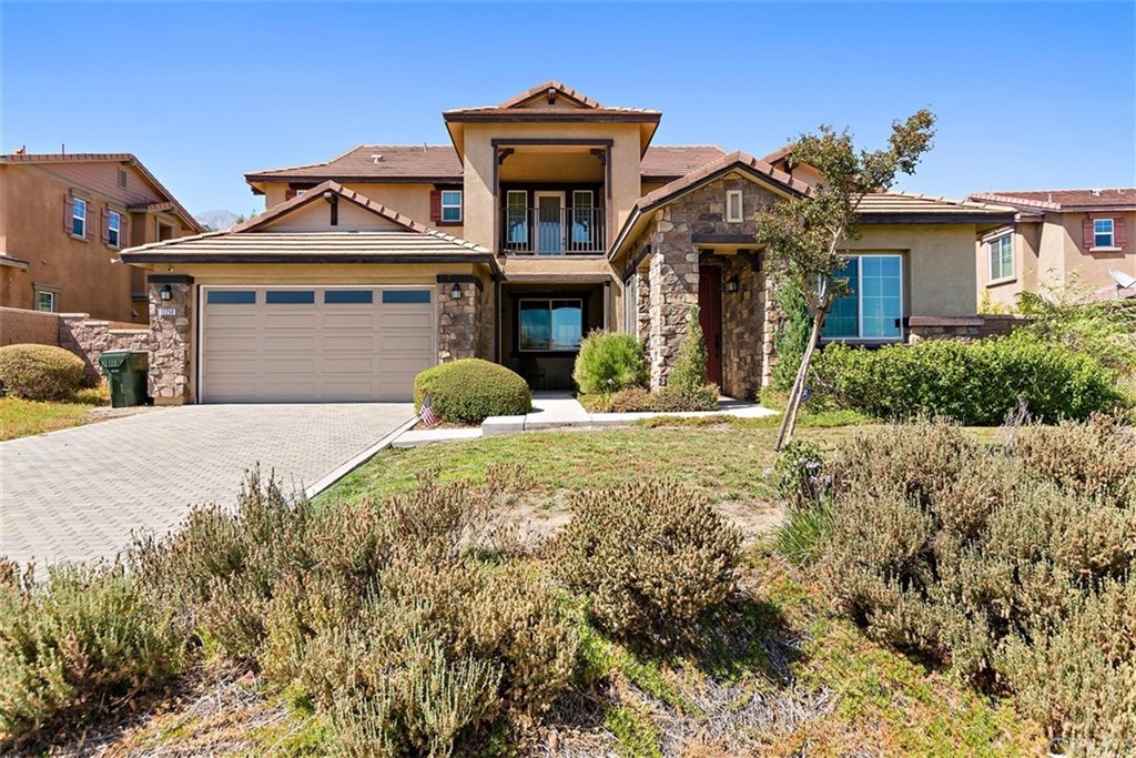 12250 Lacebark Drive Rancho Cucamonga, CA 91739 - Photo 1 of 1 a front view of a house with a yard