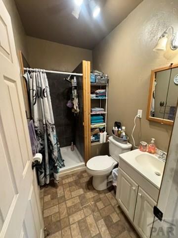11229 County Rd JJ 5 Manzanola, CO 81058 - Photo 21 of 32 a bathroom with a sink toilet and shower