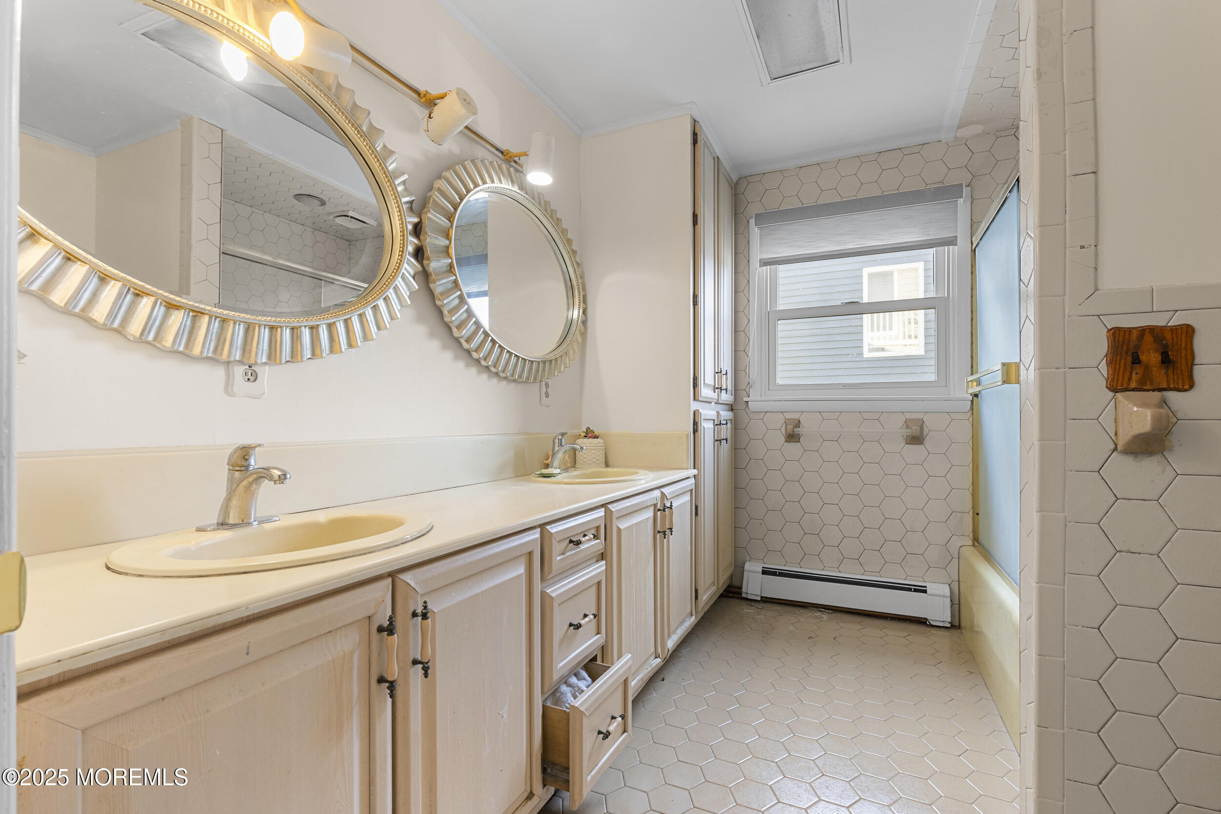 416 Dock Road Beach Haven, NJ 08008 - Photo 11 of 25 a bathroom with a double vanity sink and a mirror