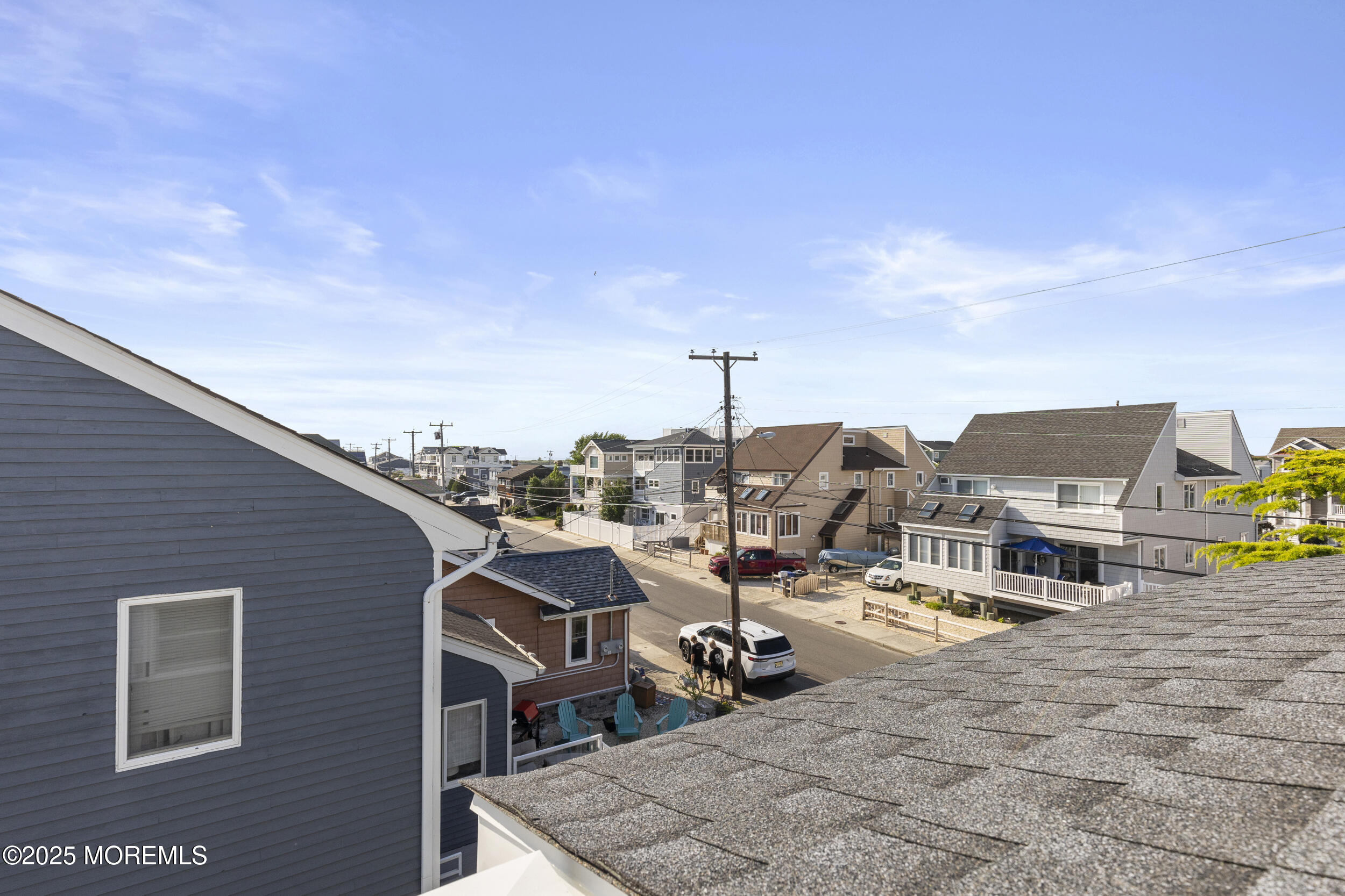 416 Dock Road Beach Haven, NJ 08008 - Photo 16 of 25 a view of roof deck with table and chairs