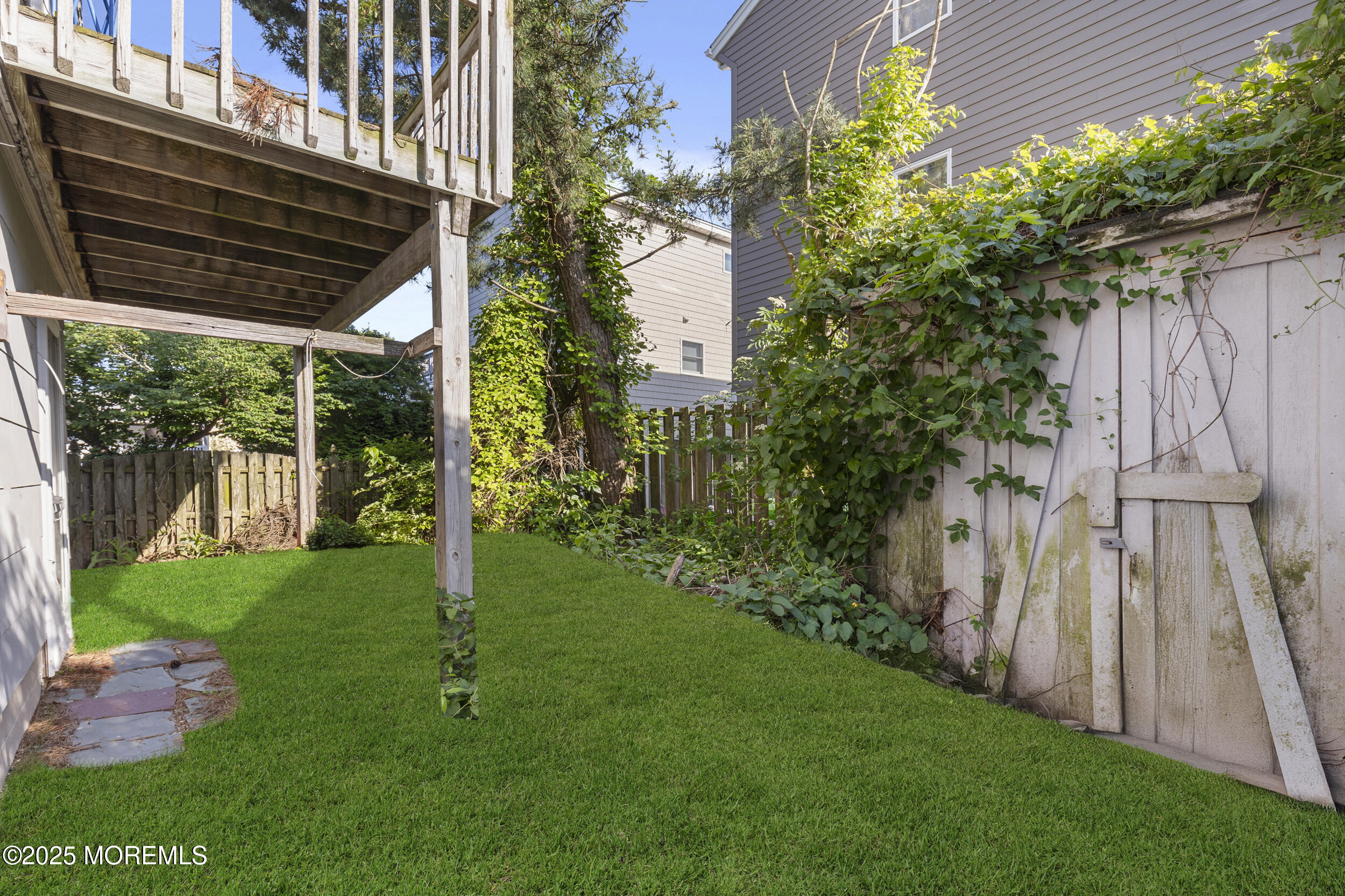 416 Dock Road Beach Haven, NJ 08008 - Photo 18 of 25 a backyard of a house with lots of green space