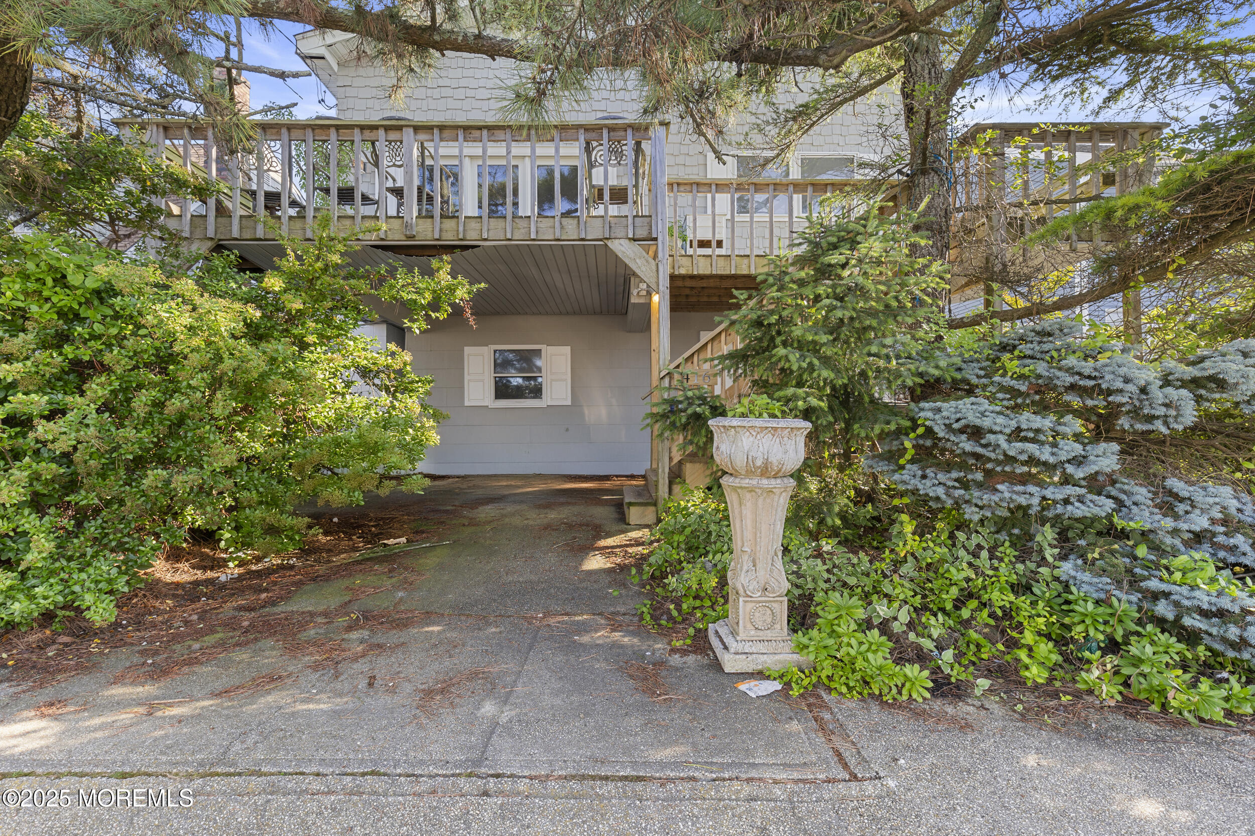 416 Dock Road Beach Haven, NJ 08008 - Photo 2 of 25 a view of a house with a yard and plants