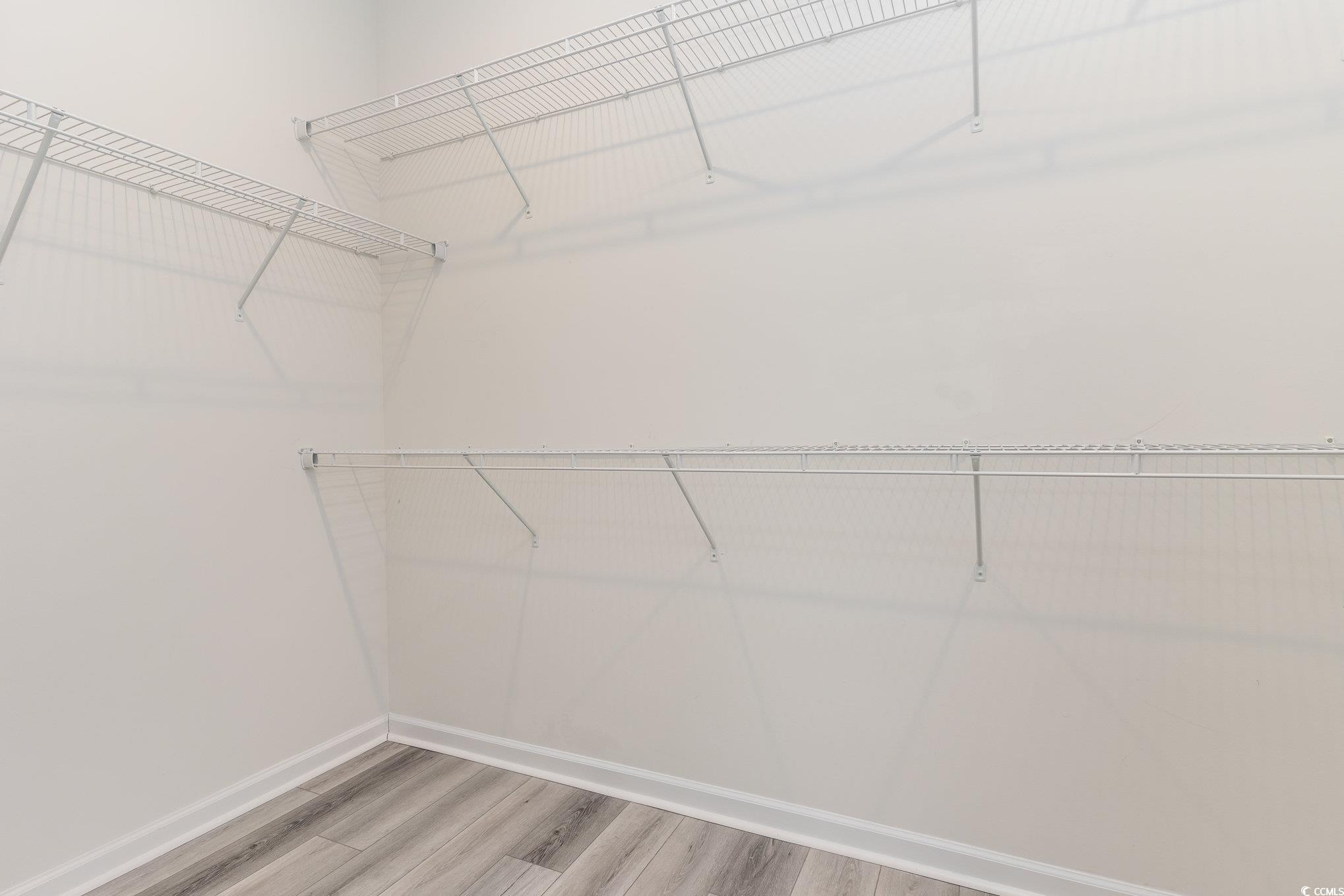 577 Rycola Circle Surfside Beach, SC 29575 - Photo 14 of 28 Walk in closet featuring wood finished floors