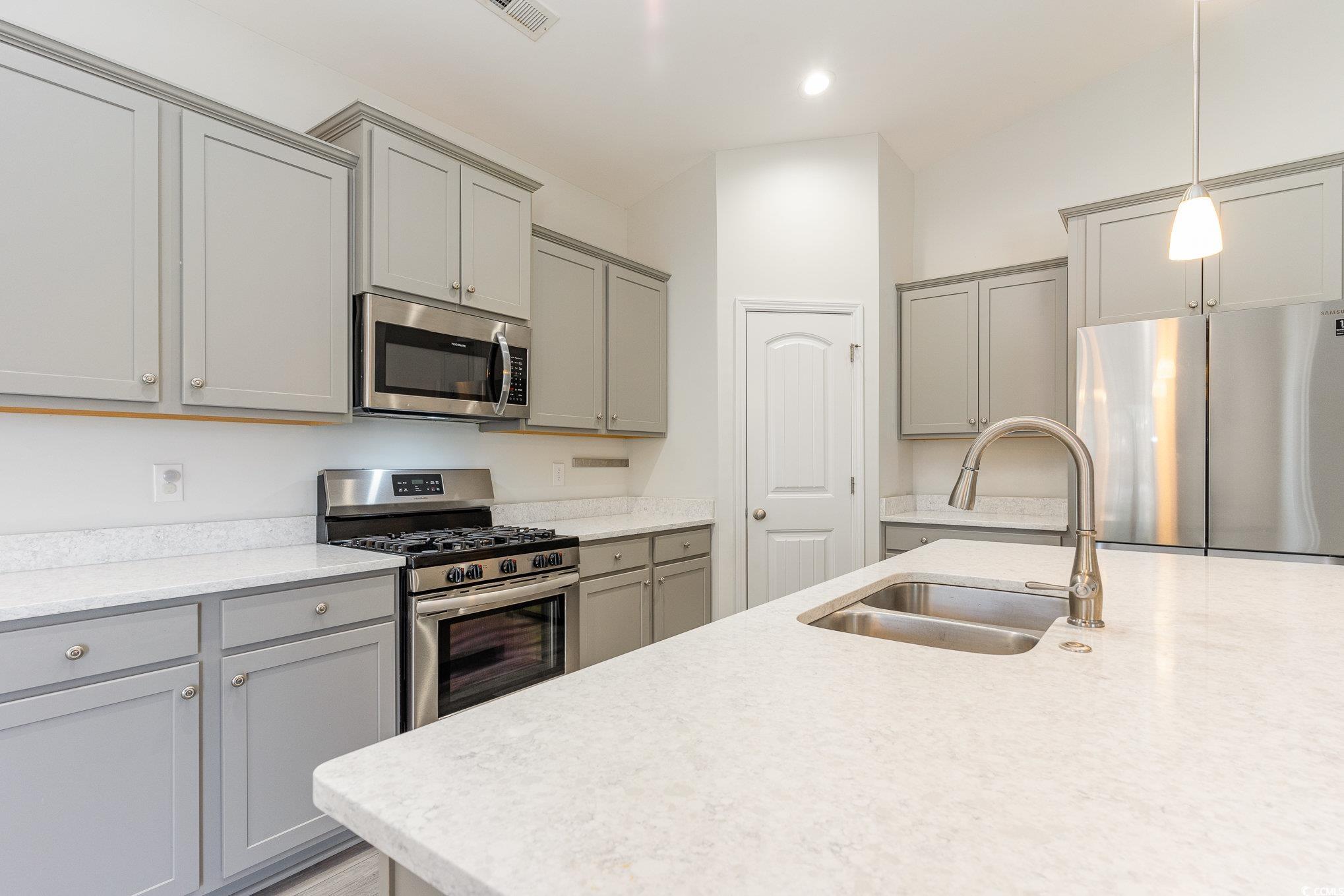 577 Rycola Circle Surfside Beach, SC 29575 - Photo 4 of 28 Kitchen with hanging light fixtures, appliances wi