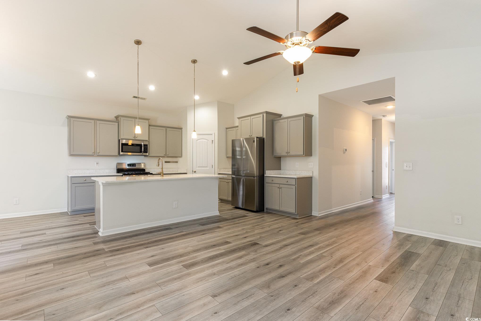 577 Rycola Circle Surfside Beach, SC 29575 - Photo 7 of 28 Kitchen with gray cabinetry, stainless steel appli