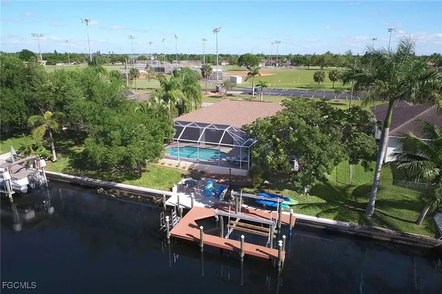an aerial view of a house with a lake view