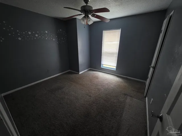 a view of empty room with windows