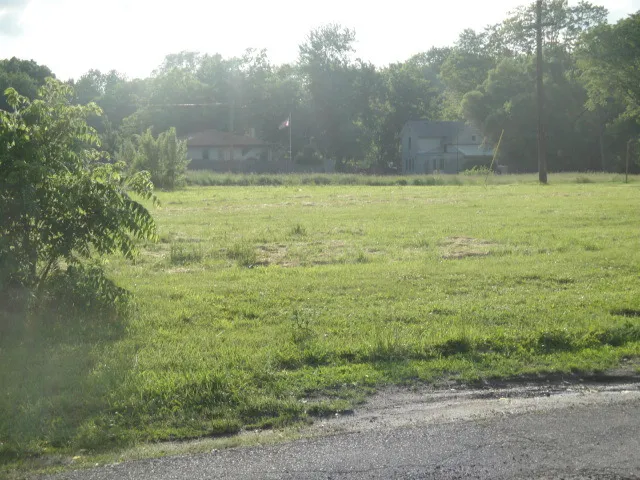 a view of a field with an outdoor space