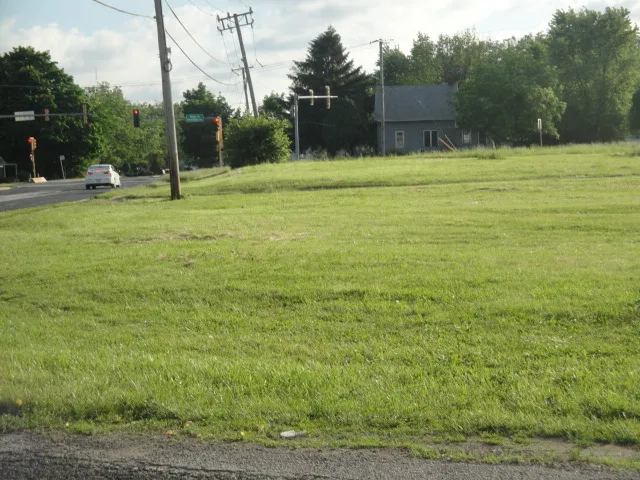 a view of outdoor space with deck and yard