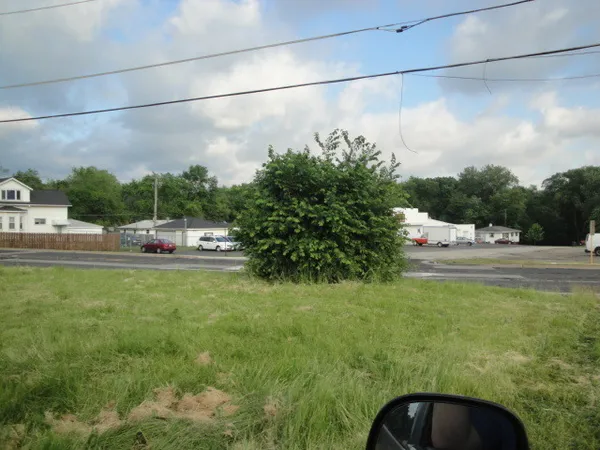 a view of yard with car parked