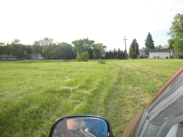 a view of a yard from a balcony