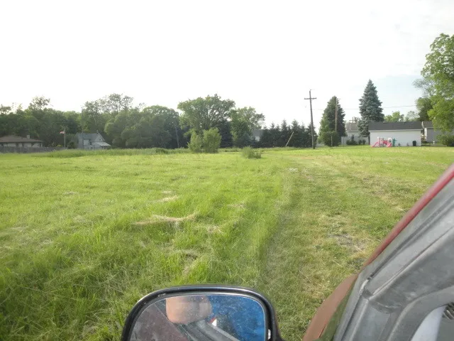 a view of a yard from a balcony