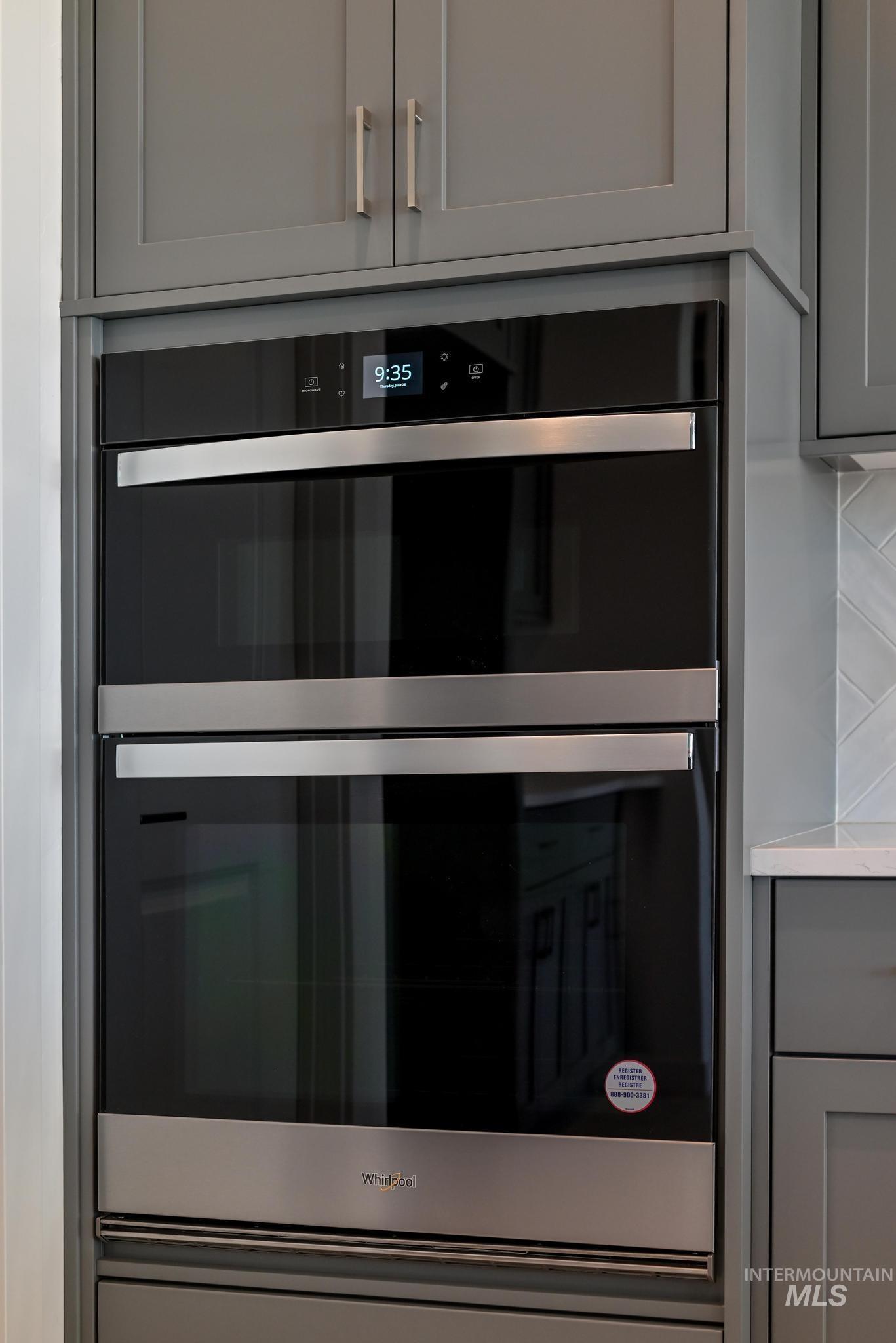 5416 Sparky Avenue Caldwell, ID 83607 - Photo 10 of 42 Kitchen view of gray cabinets, double oven, and light countertops