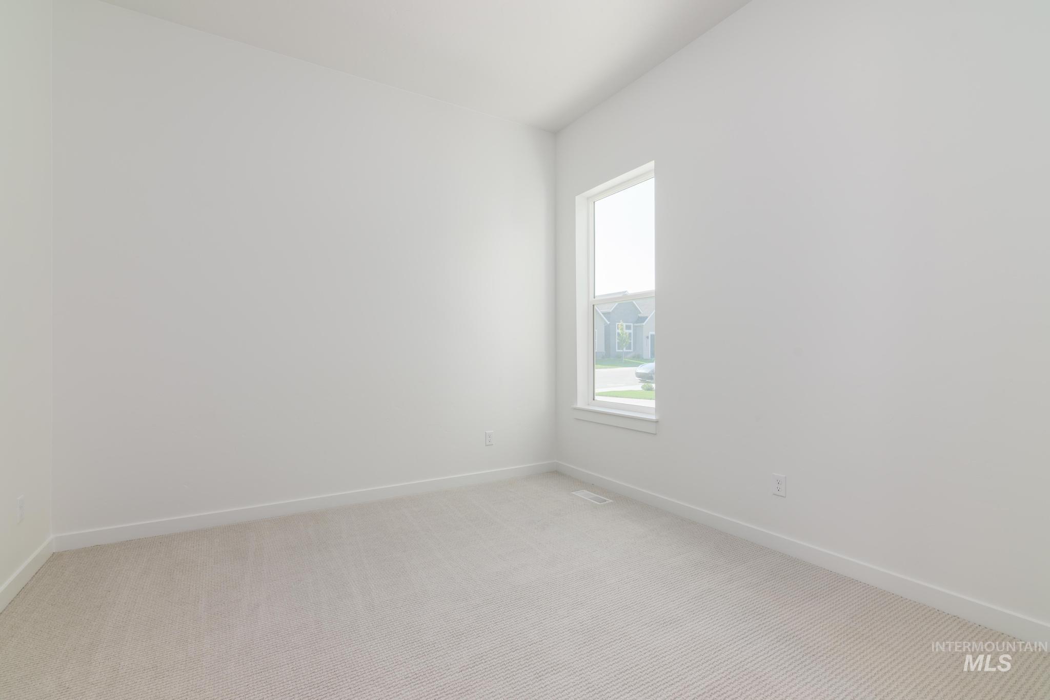 5416 Sparky Avenue Caldwell, ID 83607 - Photo 23 of 42 Unfurnished room featuring carpet flooring and baseboards