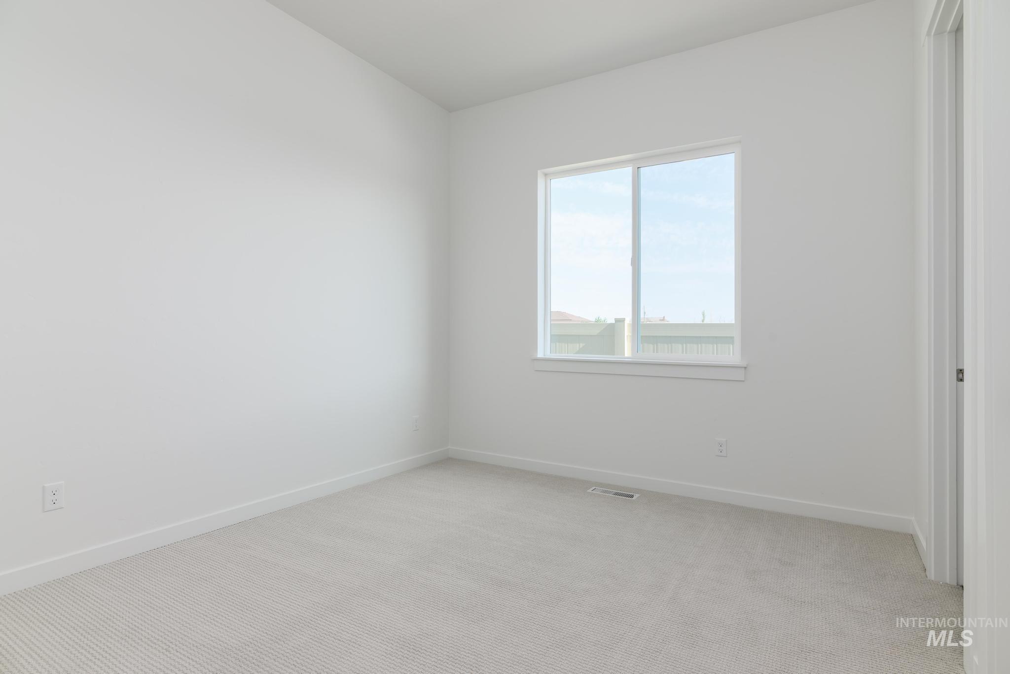 5416 Sparky Avenue Caldwell, ID 83607 - Photo 24 of 42 Unfurnished room featuring light colored carpet