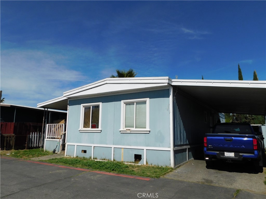 a front view of a house with parking