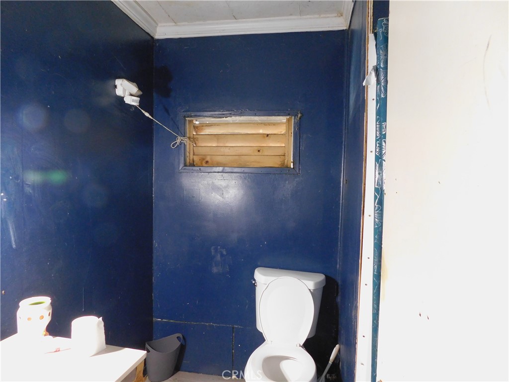 1097 North State Street, Unit 557 Hemet, CA 92543 - Photo 12 of 18 a bathroom with a toilet and a sink